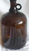 Brown and Clear Glass One Gallon Jug